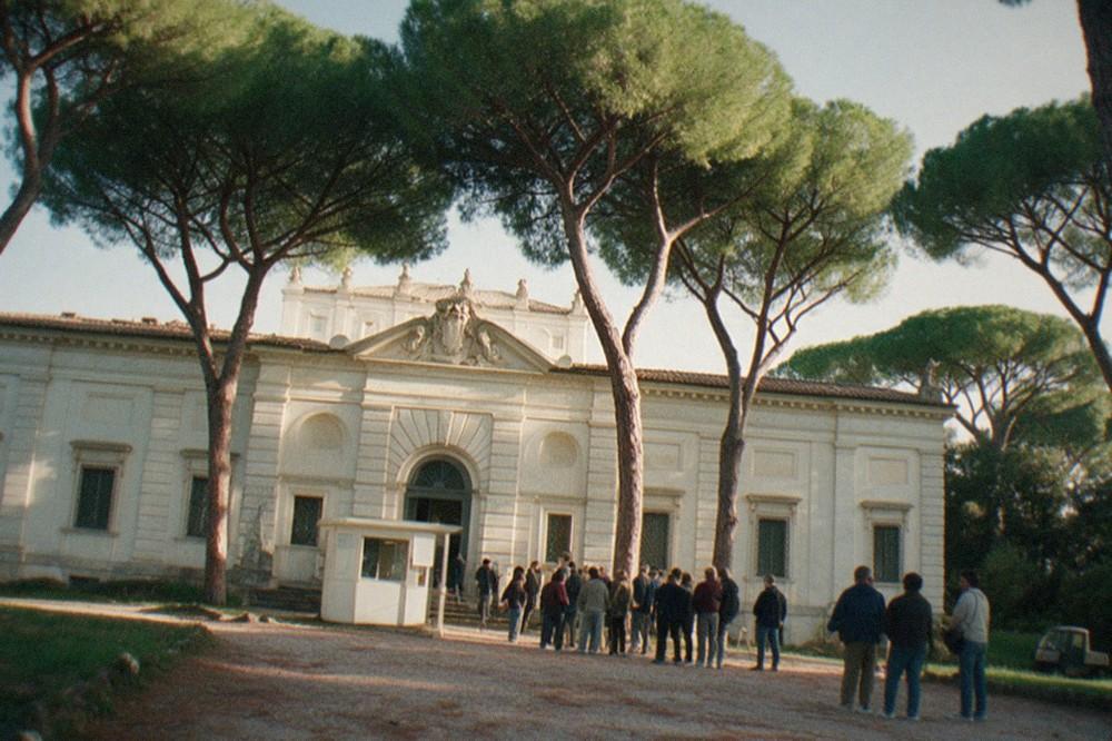 The Borghese Gallery entrance with visitors queuing outside the ticket office on a sunny morning.