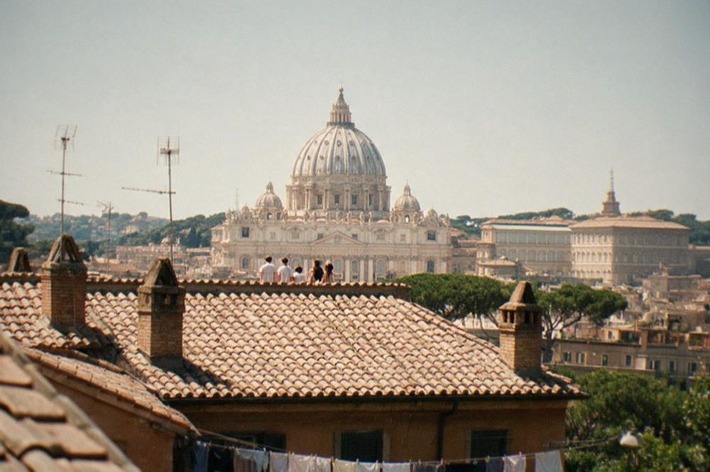 The dome of St Peter's seen from a Roman rooftop at midday
