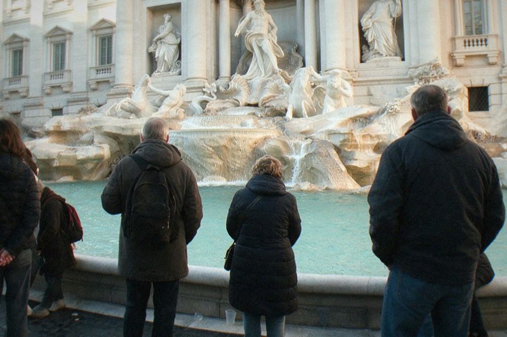 Wide view of the Trevi Fountain with few visitors around the basin in low season