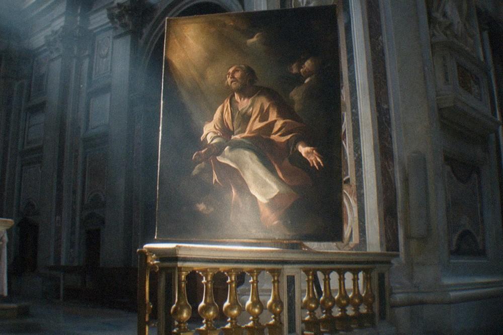 Painting of a saint being called, lit from one side, above a gilded altar rail