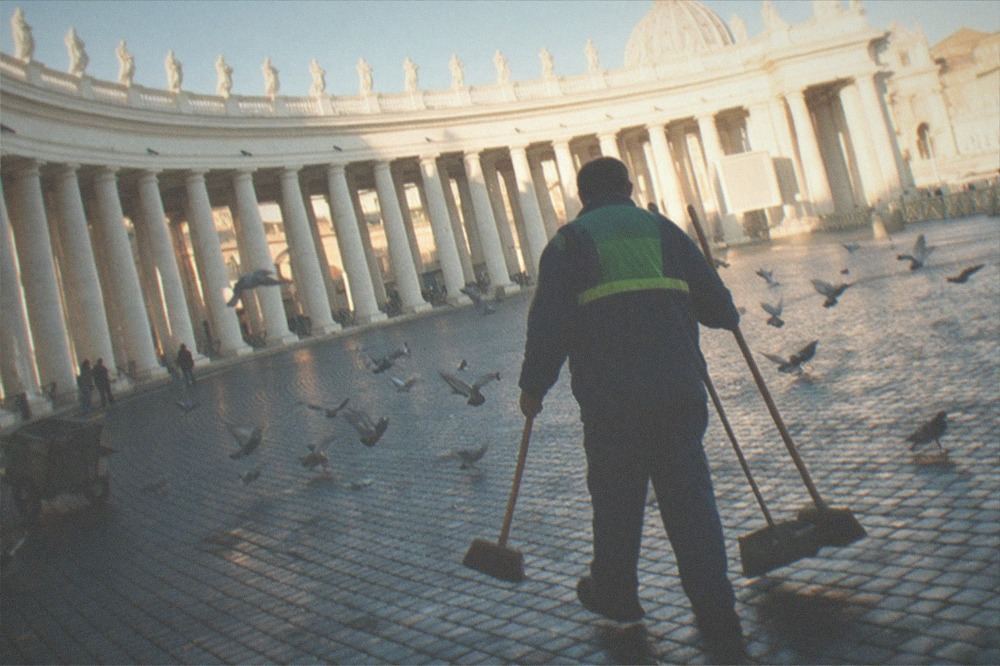 St Peter's Square colonnades in morning light with the basilica dome beyond